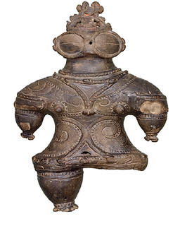 縄文時代晩期の集落遺跡亀ヶ岡石器時代遺跡（つがる市）から出土した「遮光器土偶」。およそ3000年前のものと推定されている （東京国立博物館所蔵）