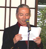 司会の渡辺・大会実行委員